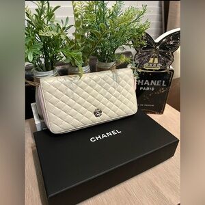CHANEL Quilted Cream Leather Zip Wallet with Silver Camellia Accent